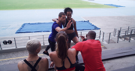 Fitness, high five and hug with people in stadium together for achievement or celebration of goals....