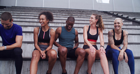 Group, people and relax on stairs at stadium for planning, fitness break and competition advice....
