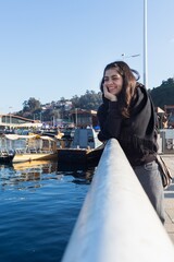 teenage girl walking on the pier