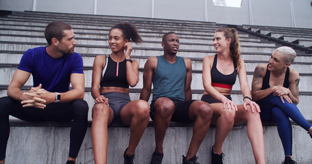 Conversation, break and fitness with friends on stadium bleachers for bonding or sports training....