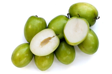 Green jujube fruits on white background.