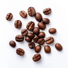 Roasted coffee beans scattered on a white background