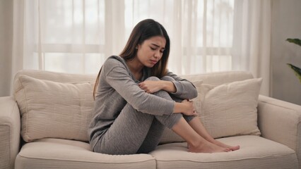 Fototapeta premium Woman having a stomachache or menstruation pain. Healthcare and medical, gynecology concept. 