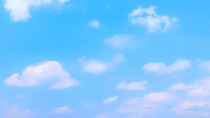 Clear blue sky and fluffy white clouds. Nature sky with soft clouds focus effect, peaceful nature...