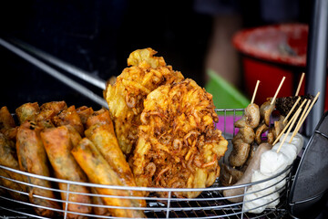 a plate of freshly fried sweet potato and shrimp cakes