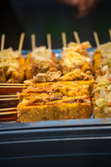 a classic Taiwanese night market snack—grilled stinky tofu