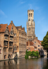 Canal scenes in the old city of Bruges with the the iconic belfry dominating the skyline, Bruges, Brugge, East Flanders, Belgium