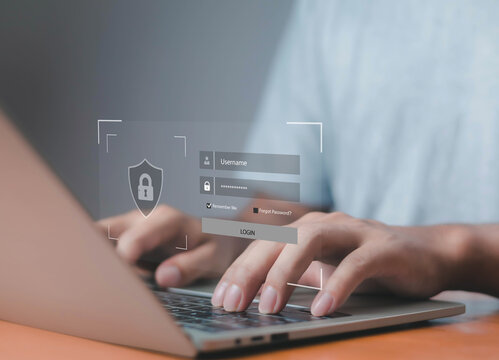 User logging into a secure system on a laptop with a holographic username and password interface, representing cybersecurity, data protection, and online account access.
