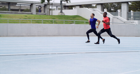 Athlete, men and running a race on track for competition practice, agility training or endurance....