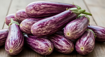 A Pile of Fresh Graffiti Eggplant on a Wooden Table