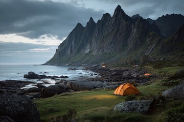 Camping experience on Senja island in Norway showcasing majestic mountains, serene coastlines, and vibrant orange tents during twilight