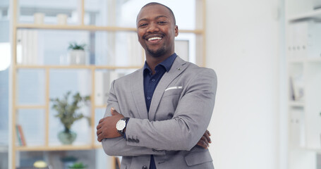 Portrait, employee and black man with arms crossed, office and financial analyst with career growth. Happy, accountant and person with ambition for business development, confident or smile in Nigeria
