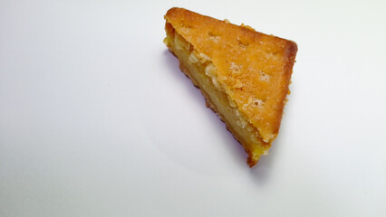 Slice of Classic Lemon Cake on White Background