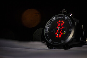 Close-Up of a Modern Hybrid Wristwatch in the Dark