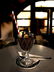 Chocolate milk shake at night in cozy café