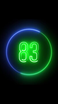 Bright neon circle surrounding number eighty three. Glowing animation. Vertical video. Glowing neon number 83 inside a green and blue circle on black background