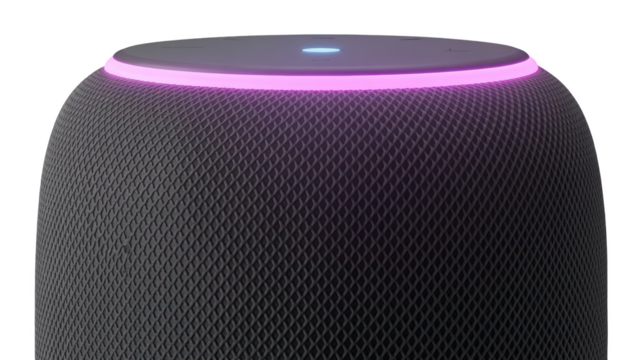 Smart speaker with illuminated light ring on top, closeup view isolated on transparent background