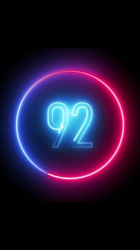 Number ninety two glowing inside a circular neon frame. Smooth animation. Vertical video. Glowing neon number 92 displayed in a circular frame against a dark background.