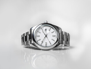 silver iron watch with white dial isolated on white background