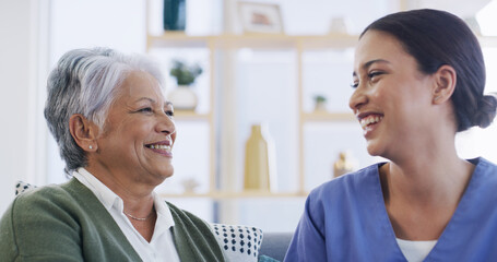 Laughing, nurse and relax with old woman on sofa for support, occupational therapist and medical....