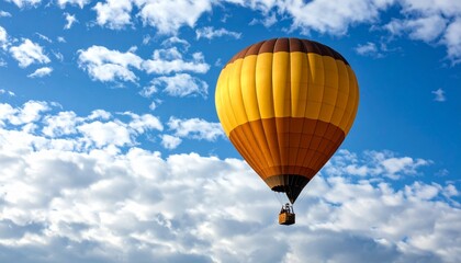 Naklejka premium Experience the freedom of flight in a hot air balloon against a backdrop of blue sky and clouds.