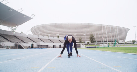Starting line, track and woman in stadium for running, practice or training for competition....