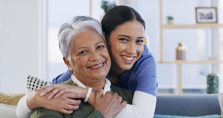 Senior woman, nurse and hug on sofa with smile, portrait and support with bonding in living room....