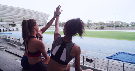 Exercise, friends and celebration with high five in stadium for workout, marathon race or running....