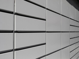 Doors to different sized storage bins of an automated mail delivery machine for the final recipient