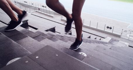 Legs, people and running on stairs at stadium of fitness, cardio exercise and marathon practice....