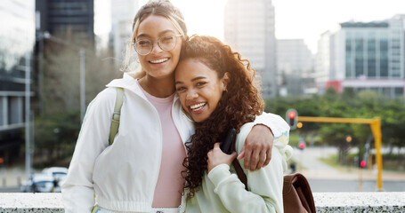 Students, friends and happy women hug in city for education, university scholarship and laugh....