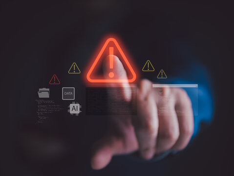 Cybersecurity warning concept with hand touching virtual alert icon, representing data breach, system error, malware, and AI security risk in digital technology environment