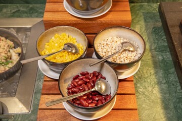 Close-Up of Salad Toppings with Beans and Corn
