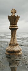 Wooden chess queen piece,  light brown,  on a watery surface