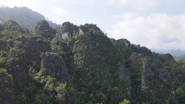 The beauty of the Sangkulirang Mangkalihat karst cliffs is surrounded by tropical rainforest in the Merabu ecotourism area, Berau Regency and East Kutai Regency, East Kalimantan, Indonesia.