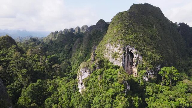 The beauty of the Sangkulirang Mangkalihat karst cliffs is surrounded by tropical rainforest in the Merabu ecotourism area, Berau Regency and East Kutai Regency, East Kalimantan, Indonesia.