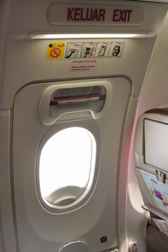 Emergency exit door in an airplane, airplane flight safety concept.