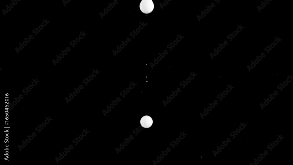 Poster a dark image features a bright round object at its center surrounded by smaller spots