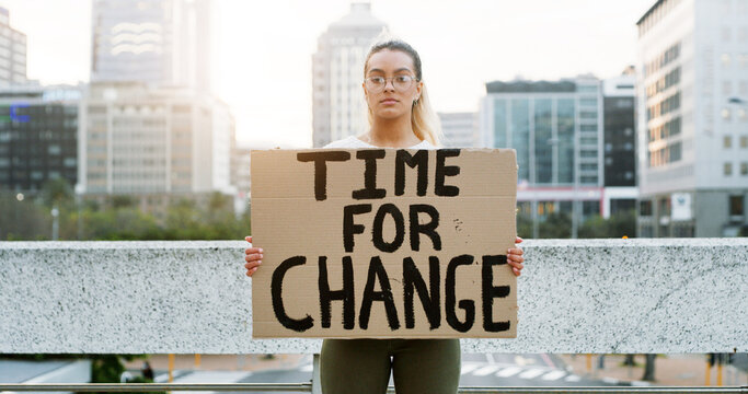 Portrait, woman and protest with banner in city of awareness, climate change and global warming. Female person, billboard poster and stop pollution of planet safety, green movement and society impact