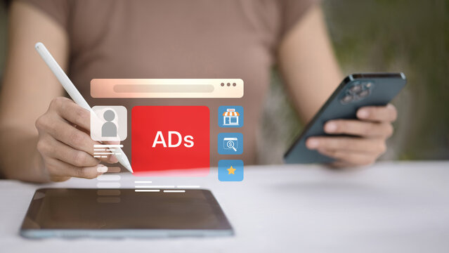 Online advertising interface on tablet with digital marketing icons