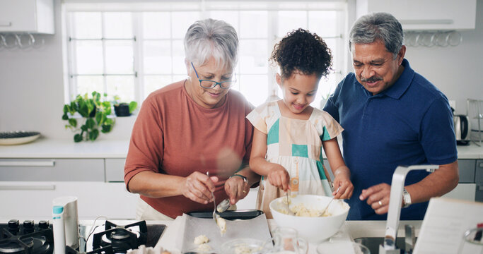 Baking, child and bonding with grandparents, kitchen or learning recipe for dessert, happy and help. Teaching, girl and old people with dough for cookies, growth and skill development for kid in home