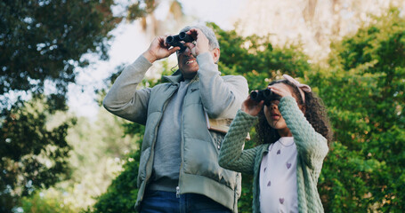 Grandfather, kid and binocular in park for travel, sightseeing or search with view for bonding. Old...