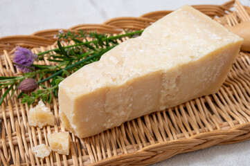 Traditional italian food, 36 months aged in caves Italian parmesan hard cheese from Parmigiano-Reggiano, Italy