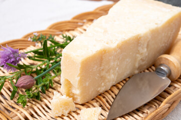 Traditional italian food, 36 months aged in caves Italian parmesan hard cheese from Parmigiano-Reggiano, Italy