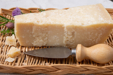 Traditional italian food, 36 months aged in caves Italian parmesan hard cheese from Parmigiano-Reggiano, Italy
