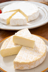 French soft cheeses collection, creamy cow's milk cheese le paysan and brie with white mold, France