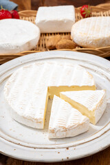 French soft cheeses collection, creamy cow's milk cheese brie with white mold, France