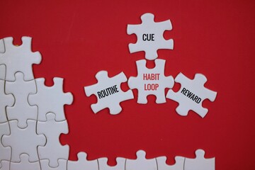 The Habit Loop Concept Is Illustrated With Puzzle Pieces That Say 'Cue, Routine, Reward' On A Red...