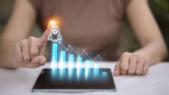Business growth concept with rocket launching from digital bar graph