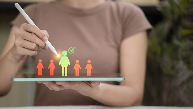 Selecting target audience using digital tablet with glowing interface